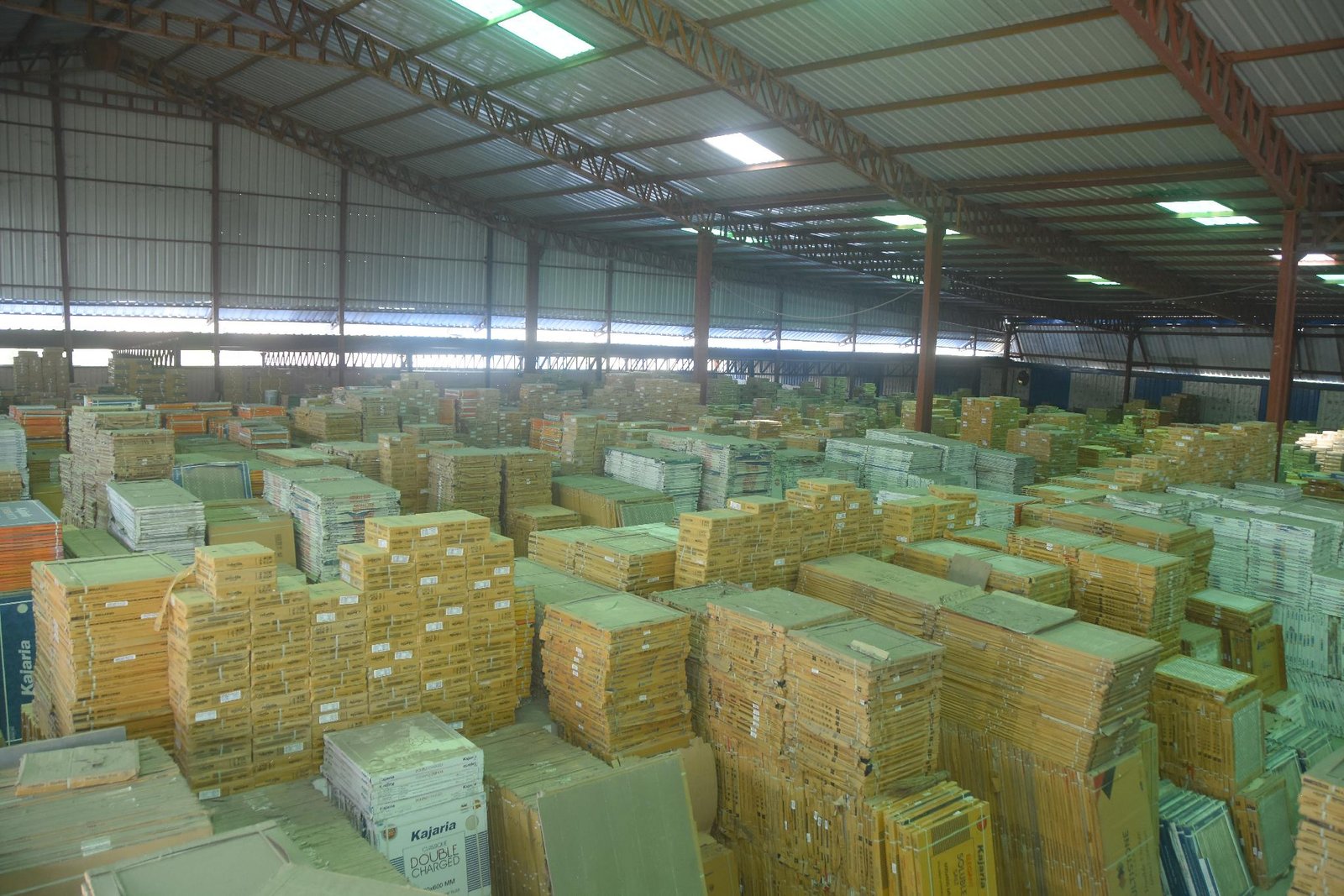 Granite and marble slabs stacked in the covered stockyard