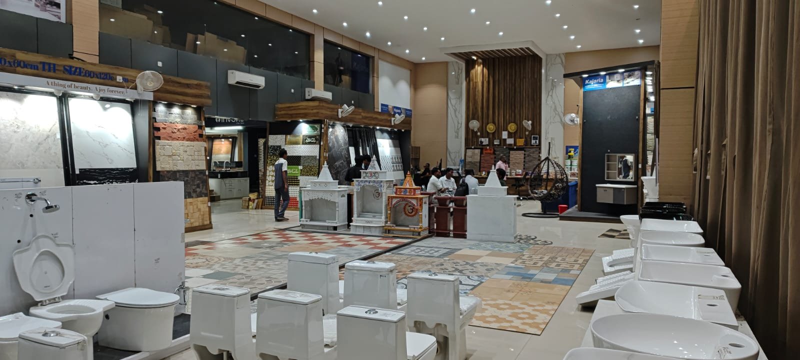 Wide view of the Dhanbad Marble showroom floor with tile and sanitaryware displays
